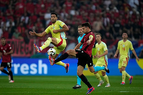 Mikel Merino tussles for the ball with Berat Djimsiti